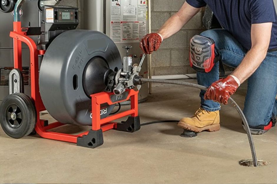 Cleaning a Drain using a machine